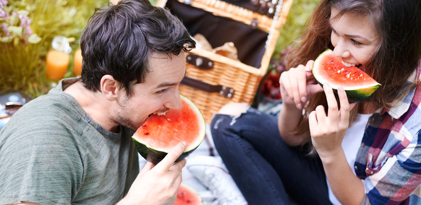 Couple eating watermelon